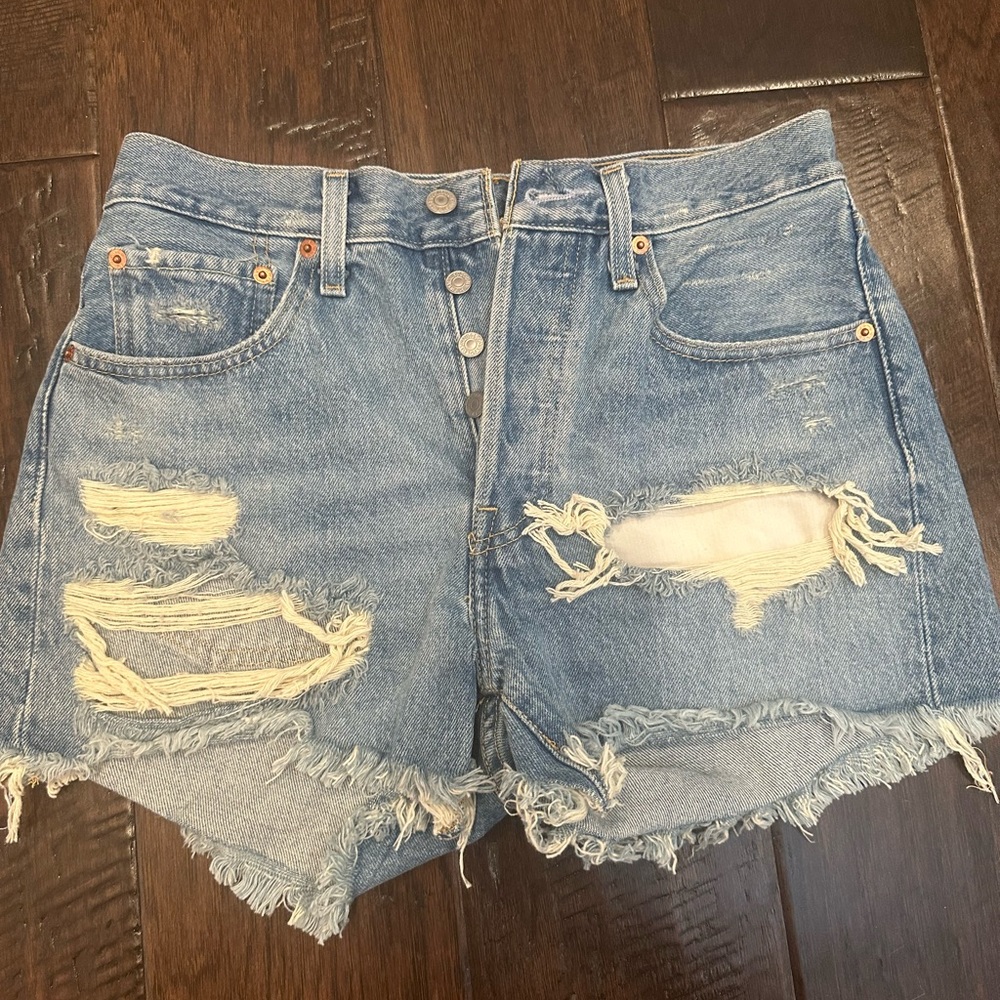 Levi’s jean shorts with rips fits size 27-29